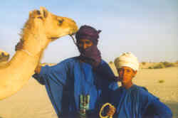 Tuareg man and his son at work