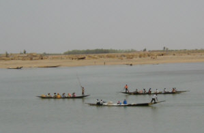 poling boats on the river Niger.